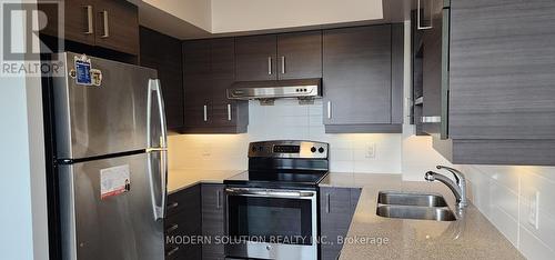 718 - 8200 Birchmount Road, Markham, ON - Indoor Photo Showing Kitchen With Stainless Steel Kitchen With Double Sink With Upgraded Kitchen