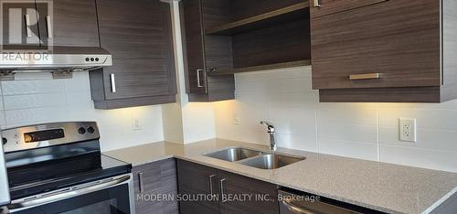 718 - 8200 Birchmount Road, Markham, ON - Indoor Photo Showing Kitchen With Double Sink