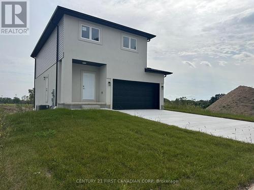 Front/ Side Entrance to Basement - 10111 Oxbow Drive, Middlesex Centre (Komoka), ON - Outdoor