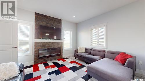 3118 Mazurak Crescent, Regina, SK - Indoor Photo Showing Living Room With Fireplace