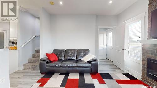 3118 Mazurak Crescent, Regina, SK - Indoor Photo Showing Living Room With Fireplace