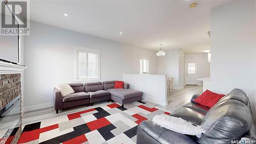 3118 Mazurak Crescent, Regina, SK - Indoor Photo Showing Living Room With Fireplace