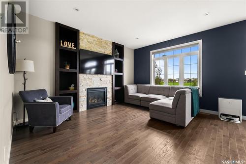 4972 Cornell Gate, Regina, SK - Indoor Photo Showing Living Room With Fireplace