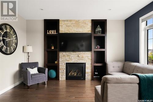 4972 Cornell Gate, Regina, SK - Indoor Photo Showing Living Room With Fireplace