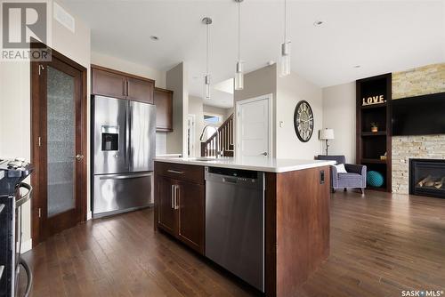 4972 Cornell Gate, Regina, SK - Indoor Photo Showing Kitchen With Fireplace With Stainless Steel Kitchen With Upgraded Kitchen