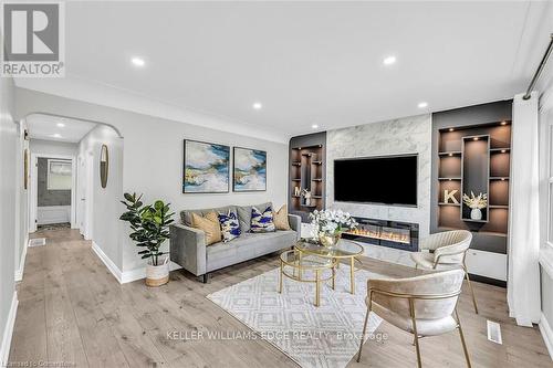 Upper - 541 East 16Th Street, Hamilton, ON - Indoor Photo Showing Living Room With Fireplace