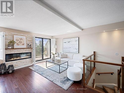 409 - 1000 Cedarglen Gate, Mississauga, ON - Indoor With Fireplace