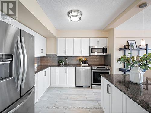 409 - 1000 Cedarglen Gate, Mississauga, ON - Indoor Photo Showing Kitchen With Stainless Steel Kitchen With Upgraded Kitchen