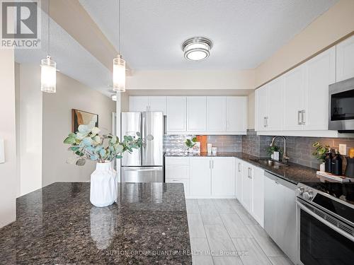 409 - 1000 Cedarglen Gate, Mississauga, ON - Indoor Photo Showing Kitchen With Stainless Steel Kitchen With Upgraded Kitchen