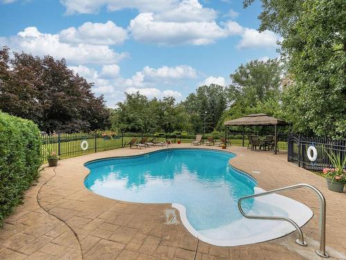 Pool - 500-270 Rue De Vimy, Saint-Bruno-De-Montarville, QC - Outdoor With In Ground Pool With Backyard