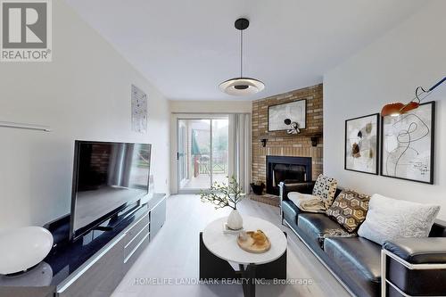 64 Alderbury Drive, Markham, ON - Indoor Photo Showing Living Room With Fireplace