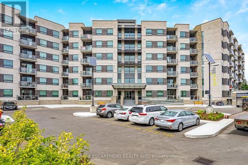 212 - 383 Main Street E, Milton, ON - Outdoor With Balcony With Facade