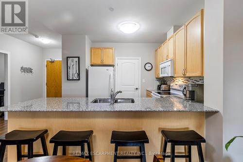 212 - 383 Main Street E, Milton, ON - Indoor Photo Showing Kitchen With Double Sink