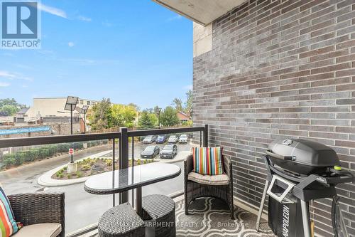 212 - 383 Main Street E, Milton, ON - Outdoor With Balcony With Exterior