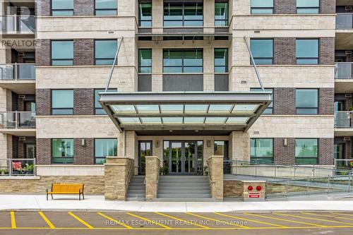 212 - 383 Main Street E, Milton, ON - Outdoor With Balcony With Facade