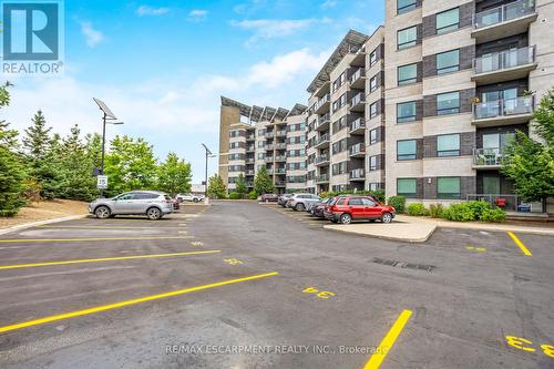 212 - 383 Main Street E, Milton, ON - Outdoor With Balcony With Facade