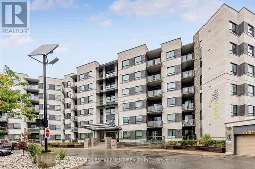 212 - 383 Main Street E, Milton, ON - Outdoor With Balcony With Facade