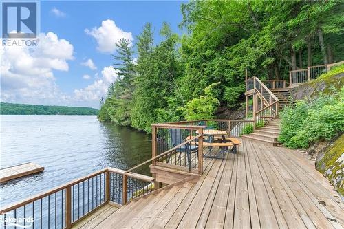 Deck / Dock on Mary Lake - 24 Ruby Lane Unit# 1, Huntsville, ON - Outdoor With Body Of Water With Deck Patio Veranda