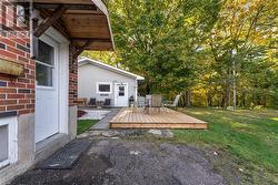 Side entry to access garage. Eating/entertaining deck area. - 