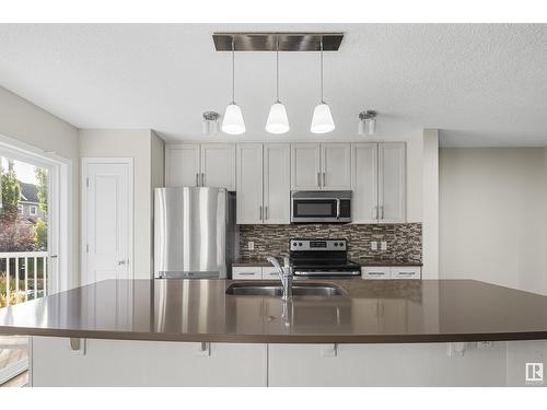 #98 4050 Savaryn Dr Sw, Edmonton, AB - Indoor Photo Showing Kitchen With Stainless Steel Kitchen With Double Sink With Upgraded Kitchen