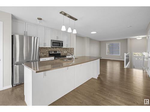 #98 4050 Savaryn Dr Sw, Edmonton, AB - Indoor Photo Showing Kitchen With Stainless Steel Kitchen With Double Sink With Upgraded Kitchen