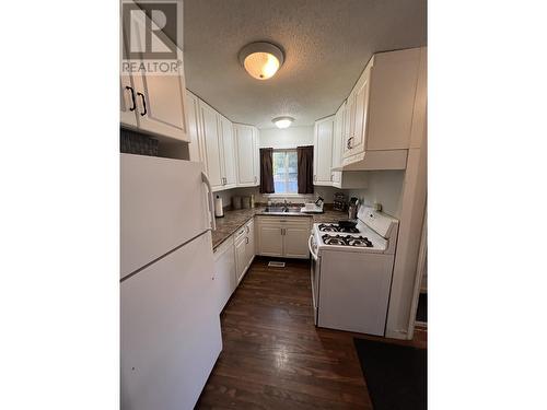 4619 Spruce Avenue, Fort Nelson, BC - Indoor Photo Showing Kitchen With Double Sink