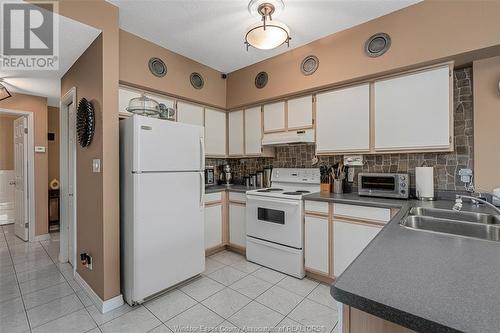 4850 Grand Boulevard Unit# 304, Windsor, ON - Indoor Photo Showing Kitchen With Double Sink