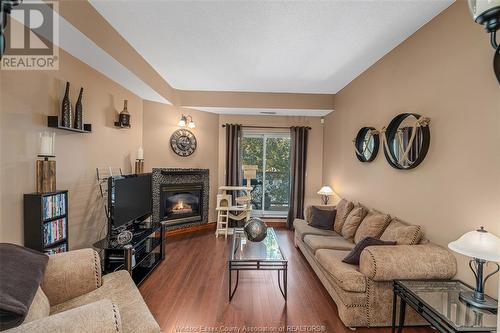 4850 Grand Boulevard Unit# 304, Windsor, ON - Indoor Photo Showing Living Room With Fireplace