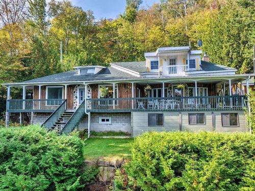 Back facade - 2306 Ch. Des Pins-Gris, La Conception, QC - Outdoor With Deck Patio Veranda