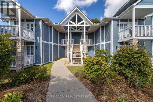 2052 - 90 Highland Drive, Oro-Medonte, ON - Outdoor With Balcony With Facade