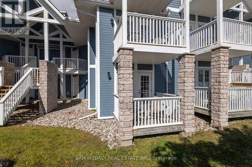 2052 - 90 Highland Drive, Oro-Medonte, ON - Outdoor With Balcony With Facade