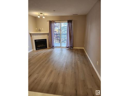 #203 2098 Blackmud Creek Dr Sw, Edmonton, AB - Indoor With Fireplace