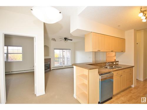 #303 5280 Terwillegar Bv Nw, Edmonton, AB - Indoor Photo Showing Kitchen With Double Sink