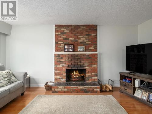 8032 Princeton Crescent, Prince George, BC - Indoor Photo Showing Living Room With Fireplace