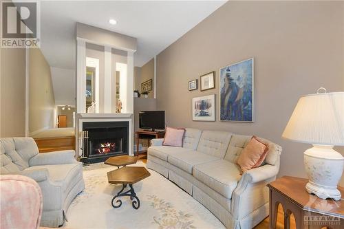 living rm with wood fireplace - 130 Hawthorne Avenue Unit#A, Ottawa, ON - Indoor Photo Showing Living Room With Fireplace