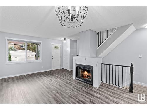 182 Tudor Ln Nw Nw, Edmonton, AB - Indoor Photo Showing Living Room With Fireplace