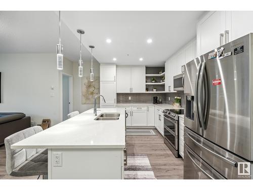 #134 1154 Adamson Dr Sw, Edmonton, AB - Indoor Photo Showing Kitchen With Stainless Steel Kitchen With Double Sink With Upgraded Kitchen