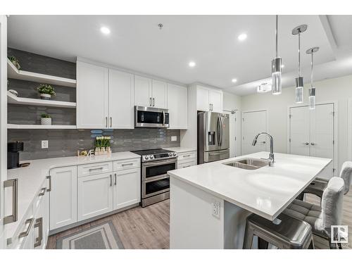 #134 1154 Adamson Dr Sw, Edmonton, AB - Indoor Photo Showing Kitchen With Stainless Steel Kitchen With Double Sink With Upgraded Kitchen