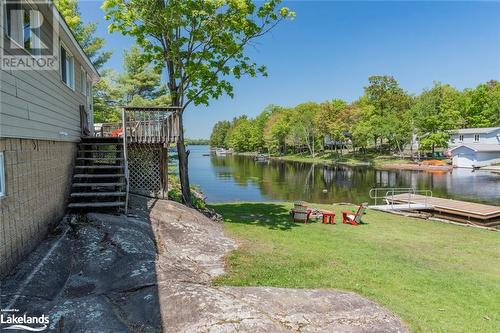 Easy walk off The Deck of 2nd Cottage down to The Dock - 285 Crooked Bay Road, Port Severn, ON - Outdoor With Body Of Water