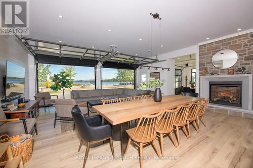 93-44 Potato Island Road, Georgian Bay, ON - Indoor Photo Showing Dining Room With Fireplace