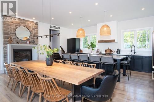 93-44 Potato Island Road, Georgian Bay, ON - Indoor Photo Showing Dining Room With Fireplace