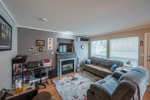 2-607 4Th Street, Keremeos, BC - Indoor Photo Showing Living Room With Fireplace