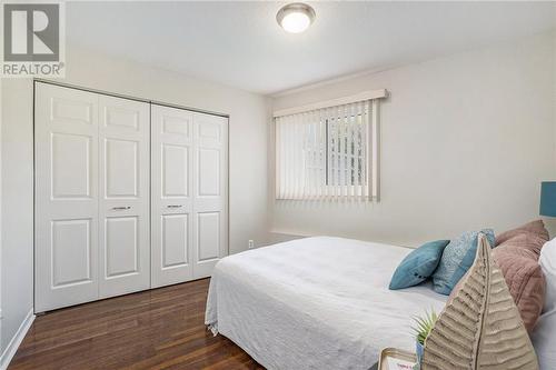 Primary bedroom with large closet. - 26 Pearl Street Unit#107, Smiths Falls, ON - Indoor Photo Showing Bedroom