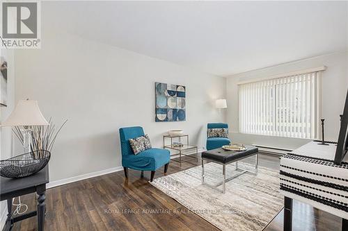 107 - 26 Pearl Street, Smiths Falls, ON - Indoor Photo Showing Living Room With Fireplace