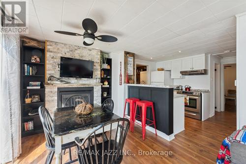 33 Hillcrest Avenue, Kawartha Lakes, ON - Indoor Photo Showing Dining Room With Fireplace