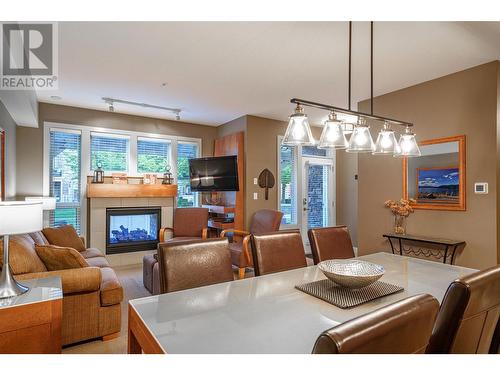 7343 Okanagan Landing Road Unit# 1121, Vernon, BC - Indoor Photo Showing Dining Room With Fireplace