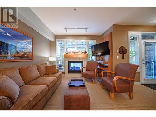 7343 Okanagan Landing Road Unit# 1121, Vernon, BC - Indoor Photo Showing Living Room With Fireplace