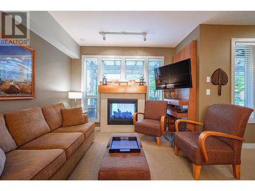 7343 Okanagan Landing Road Unit# 1121, Vernon, BC - Indoor Photo Showing Living Room With Fireplace