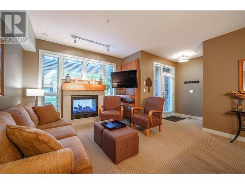 7343 Okanagan Landing Road Unit# 1121, Vernon, BC - Indoor Photo Showing Living Room With Fireplace