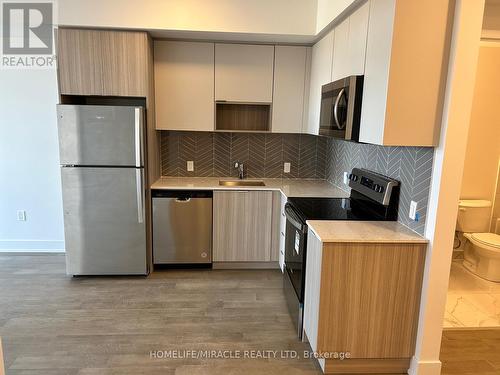 705W - 202 Burnhamthorpe Road E, Mississauga, ON - Indoor Photo Showing Kitchen With Stainless Steel Kitchen